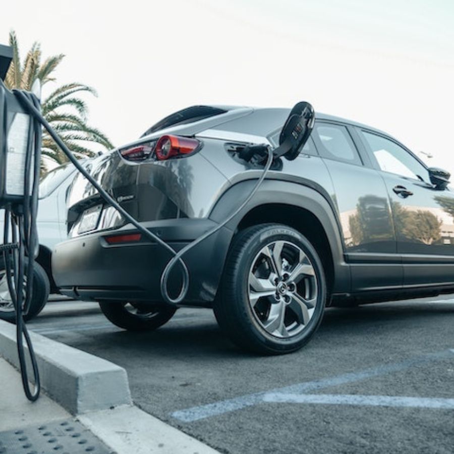 an electric car charging at a charging dock